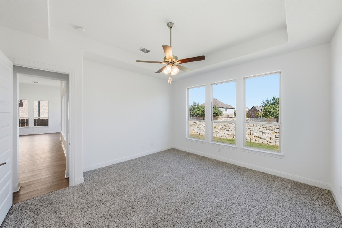 1208 Terrace View Drive Georgetown, TX 78628 - Photo 7 of 15 an empty room with fan and windows