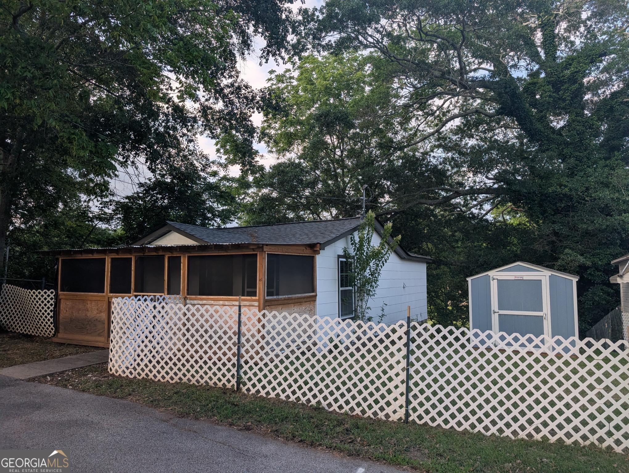 128 Branch Street Toccoa, GA 30577 - Photo 15 of 38 a front view of a house with a garden