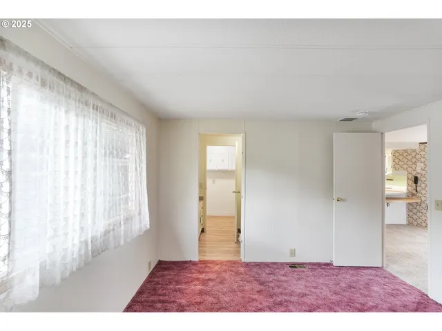 a view of an empty room and window