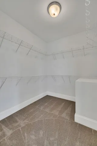 a view of cabinets and wooden floor