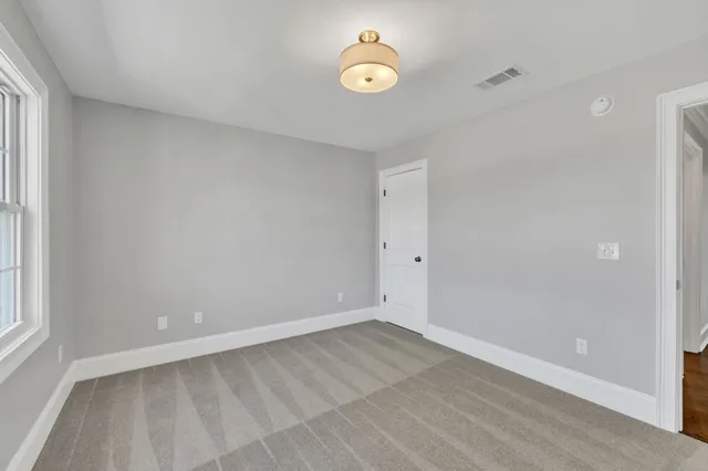a bathroom with a bathtub a sink and a mirror