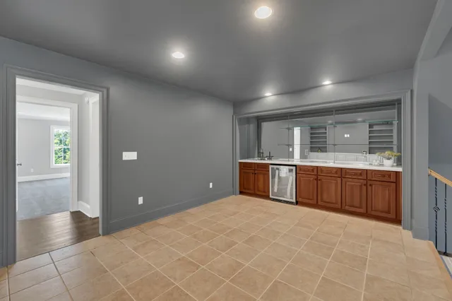 a view of a patio with table and chairs and potted plants