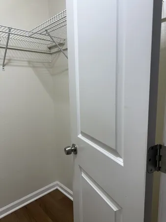 a bathroom with a shower and a door