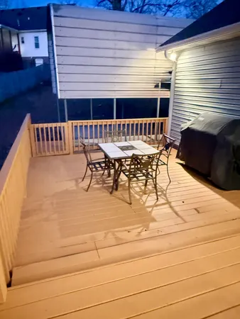 a view of a patio with a table and chairs