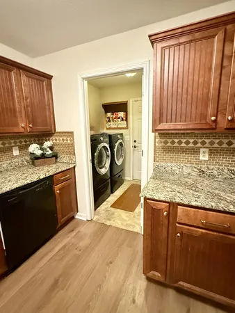 a kitchen with wooden cabinets and a stove top oven