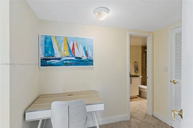 a view of a hallway with paintings on the wall