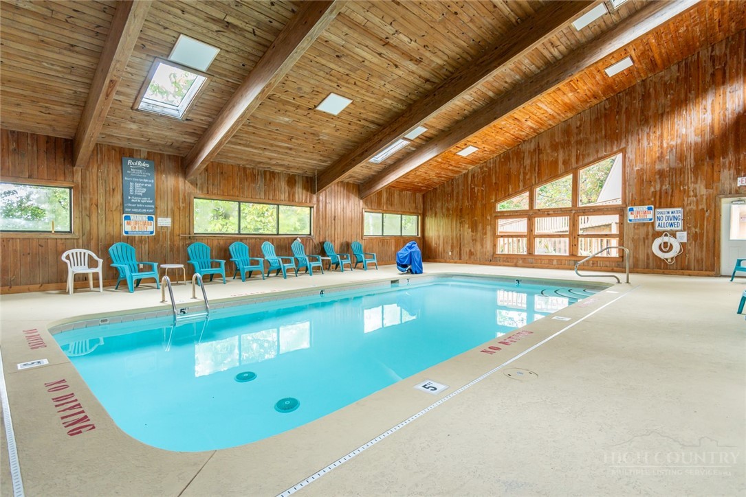 220 Charter Hills Road, Unit C3 Beech Mountain, NC 28604 - Photo 4 of 32 a view of a swimming pool with a patio