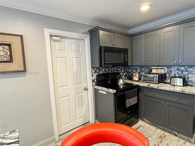 a view of a hallway with washer and dryer