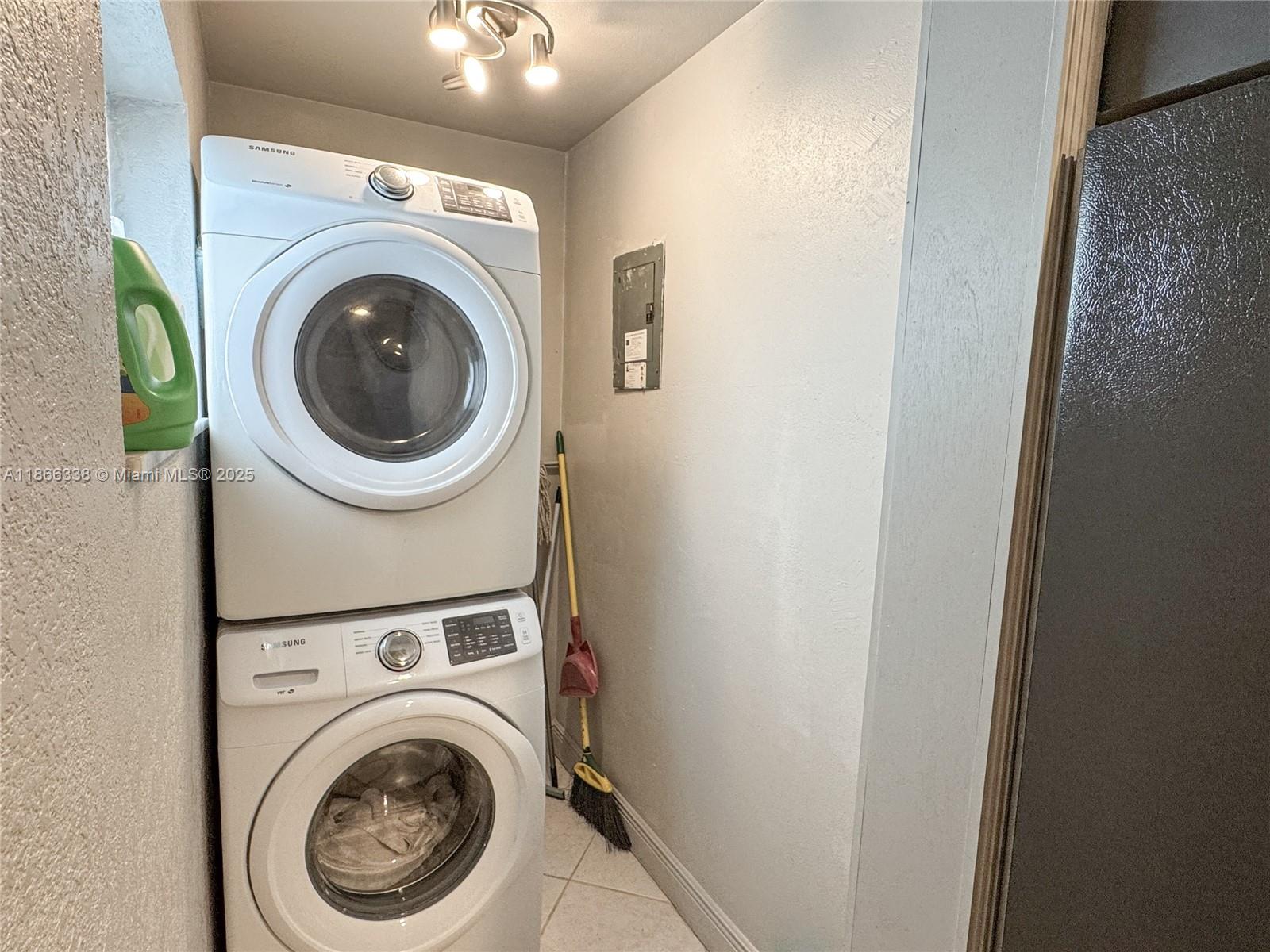 161 Northwest 27th Court Pompano Beach, FL 33064 - Photo 12 of 33 a view of a hallway with washer and dryer