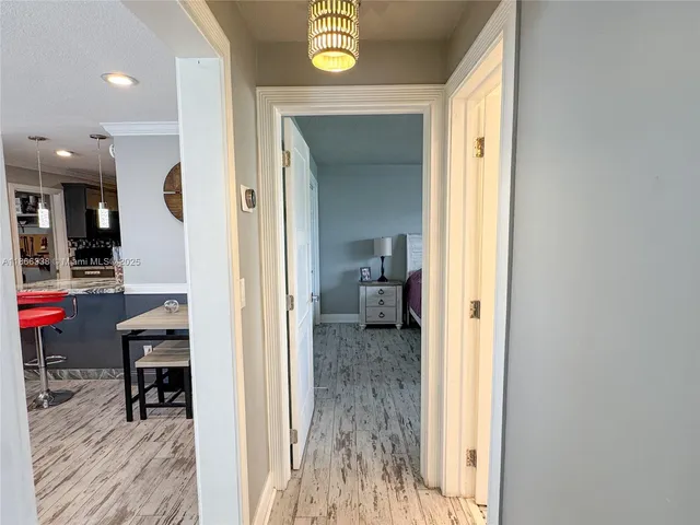 a bedroom with a bed and a ceiling fan