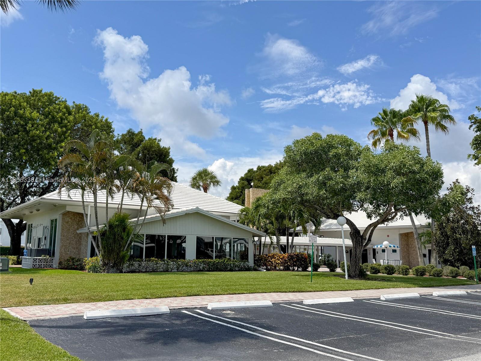 161 Northwest 27th Court Pompano Beach, FL 33064 - Photo 25 of 33 a front view of a house with a yard