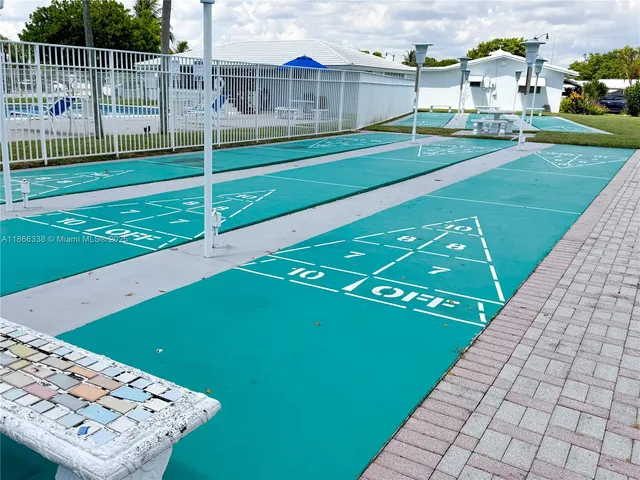 a view of swimming pool with outdoor seating and plants