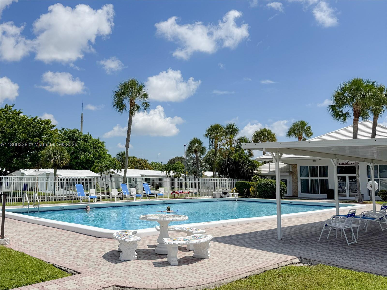 161 Northwest 27th Court Pompano Beach, FL 33064 - Photo 28 of 33 a view of a house with a fountain