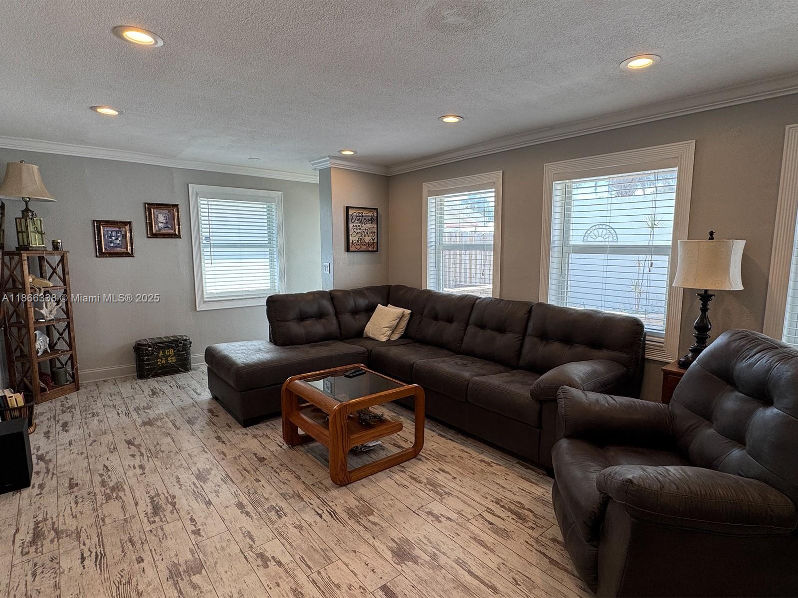 161 Northwest 27th Court Pompano Beach, FL 33064 - Photo 6 of 33 a living room with furniture and a window