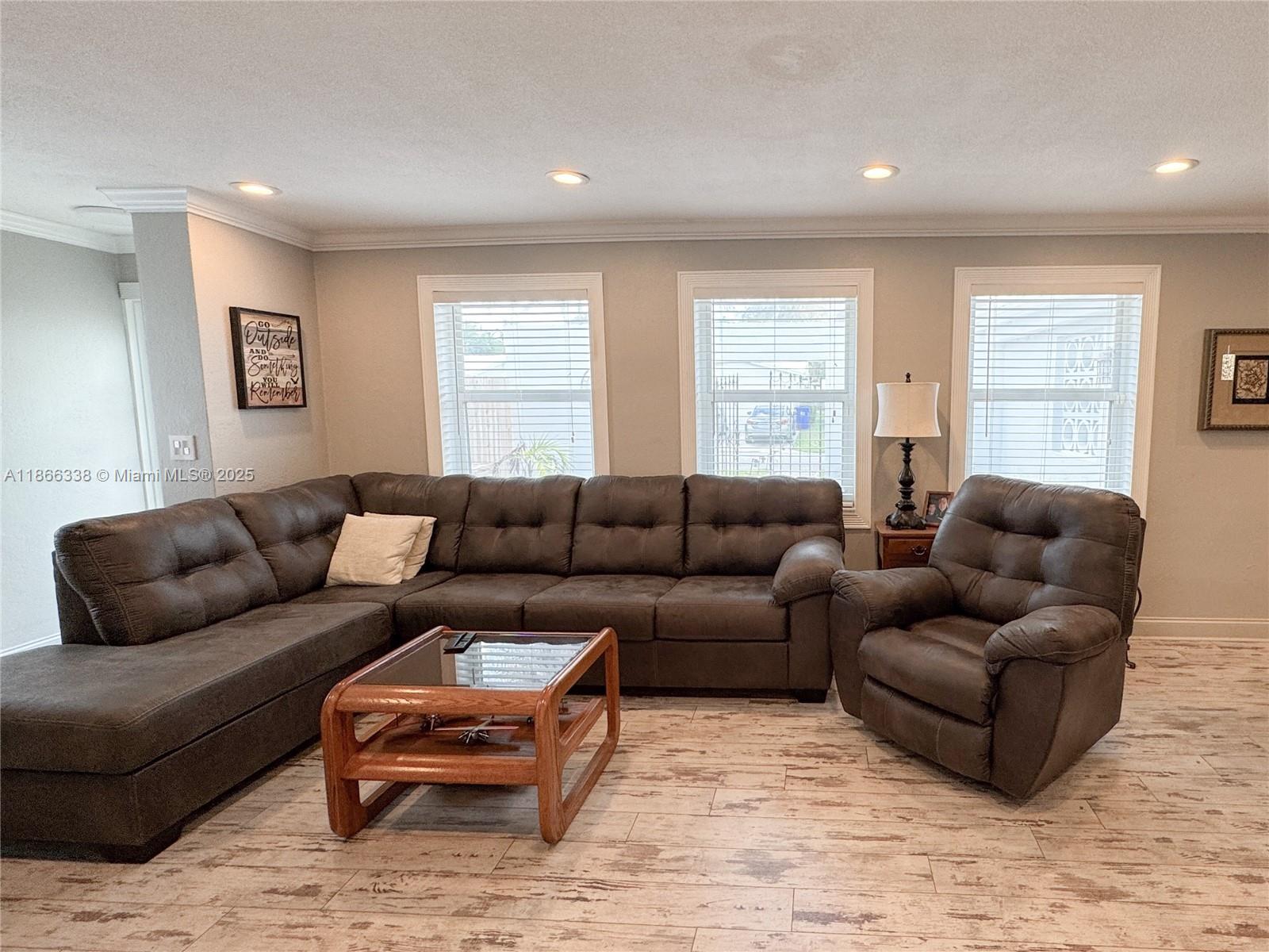 161 Northwest 27th Court Pompano Beach, FL 33064 - Photo 7 of 33 a living room with furniture and a large window