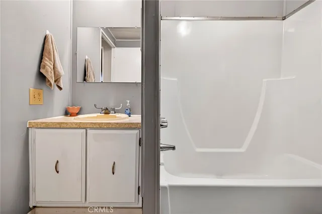 a bathroom with a bathtub and a sink