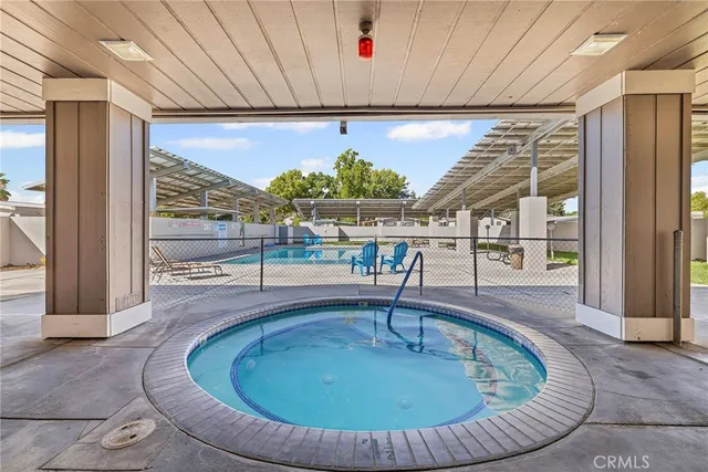 a view of a backyard with sitting area