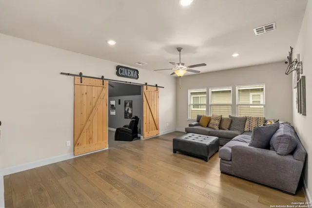 a living room with furniture and a window
