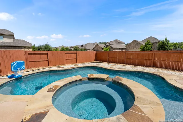 a view of swimming pool having outdoor seating