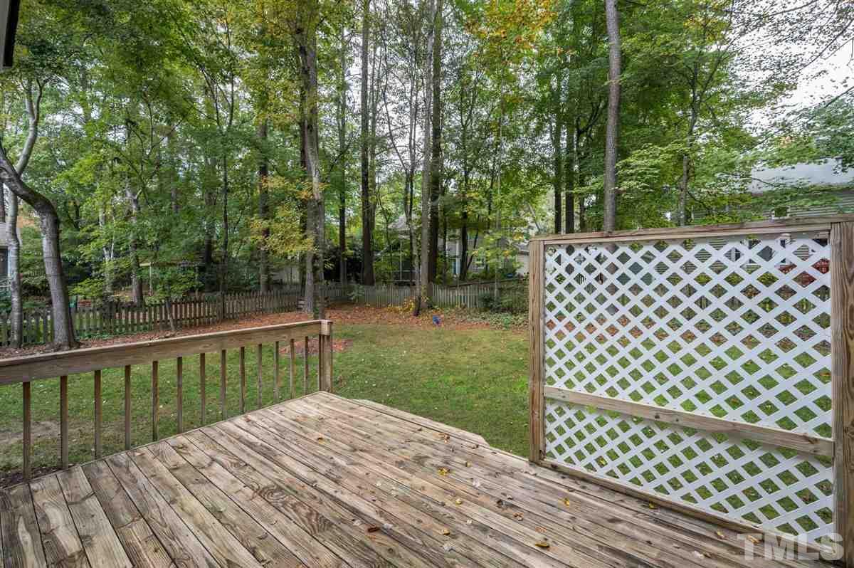 5617 Barham Court Raleigh, NC 27613 - Photo 2 of 30 a view of a backyard with wooden fence