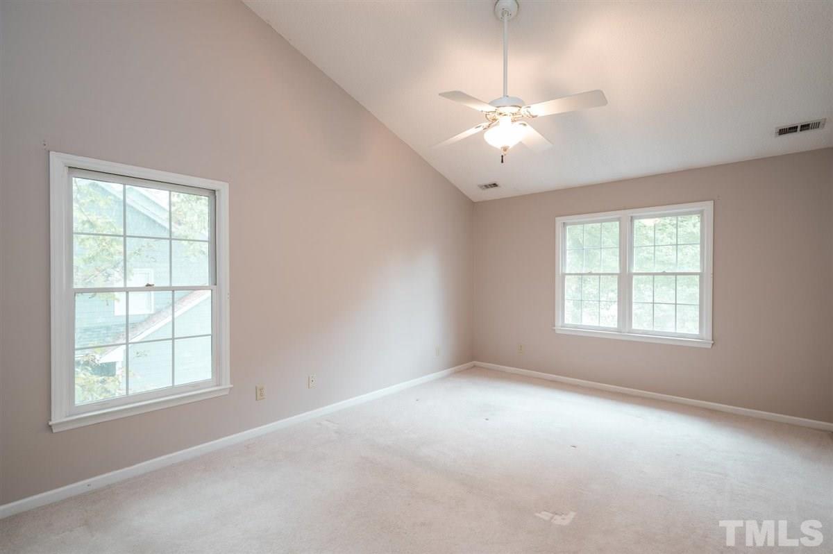 5617 Barham Court Raleigh, NC 27613 - Photo 22 of 30 an empty room with a window and a fan