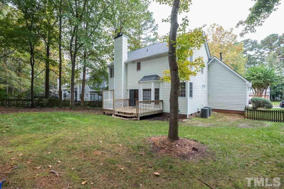 5617 Barham Court Raleigh, NC 27613 - Photo 4 of 30 a view of a house with backyard