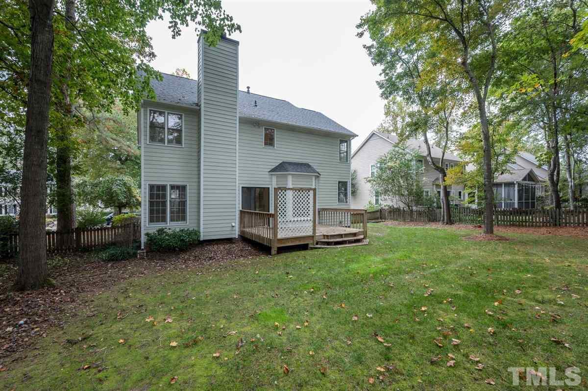 5617 Barham Court Raleigh, NC 27613 - Photo 5 of 30 a view of a house with a yard and sitting area