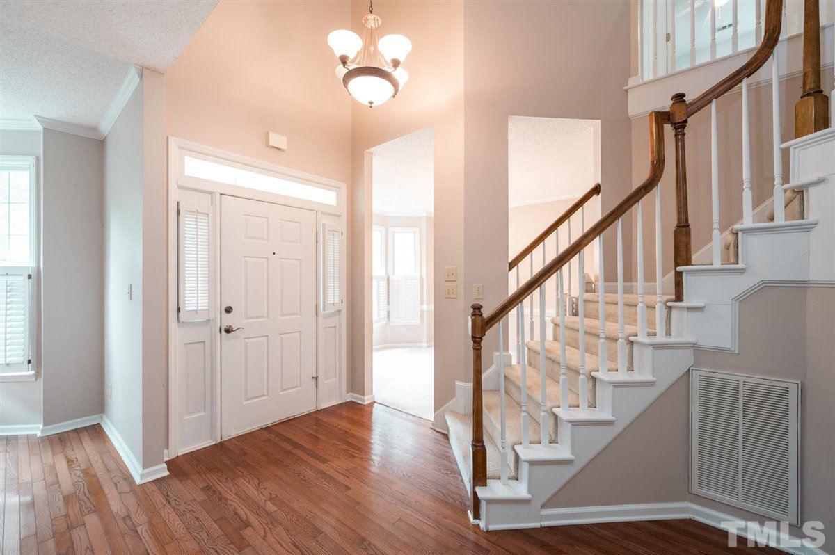 5617 Barham Court Raleigh, NC 27613 - Photo 7 of 30 a view of entryway and hall with wooden floor