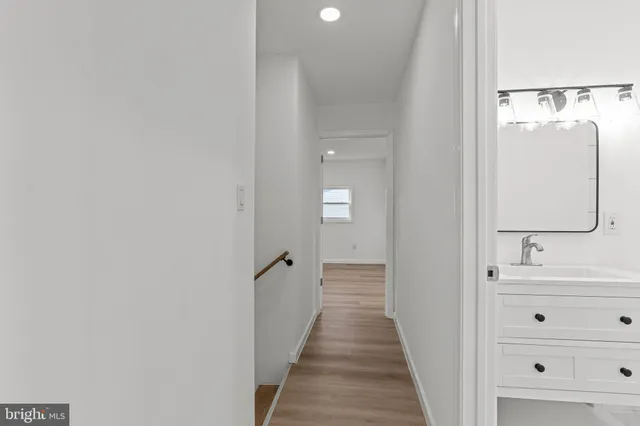 a view of a bathroom from the hallway