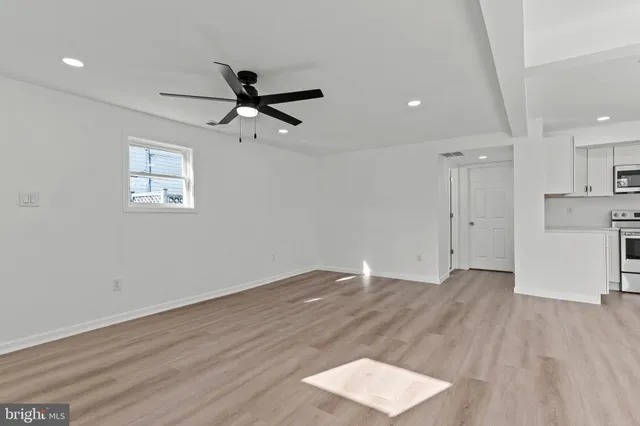 a view of an empty room with a window