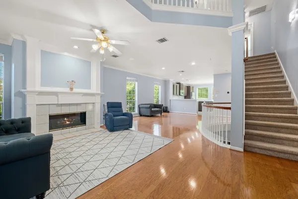 a living room with furniture and a fireplace