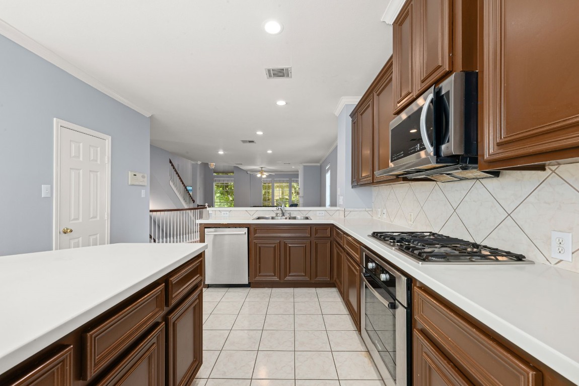 2937 Jackson Street Houston, TX 77004 - Photo 15 of 28 a kitchen with a sink a stove and cabinets