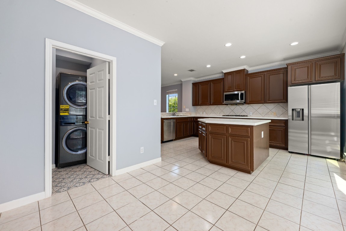 2937 Jackson Street Houston, TX 77004 - Photo 17 of 28 a kitchen with stainless steel appliances granite countertop a refrigerator and a stove top oven