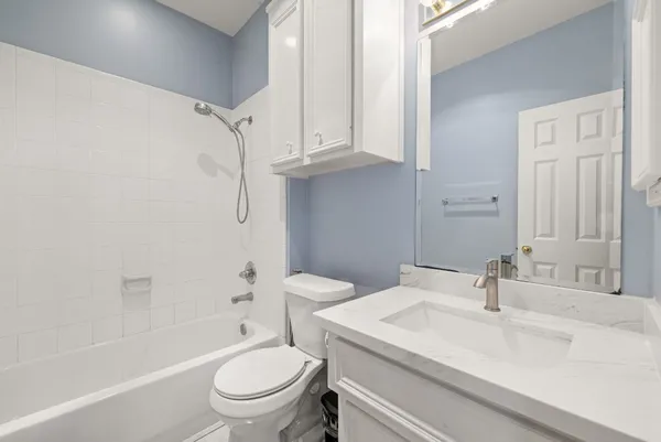 a bathroom with a sink a toilet and a bathtub