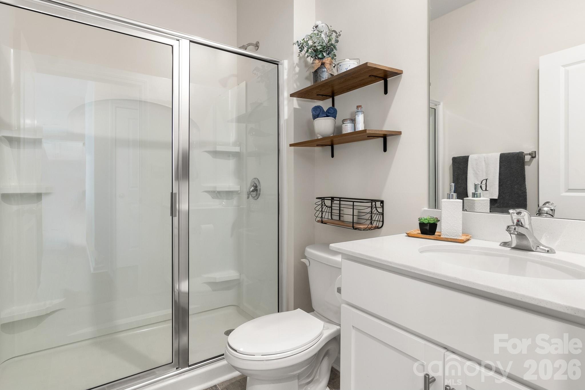 744 Saddlebred Lane Locust, NC 28097 - Photo 20 of 47 a bathroom with a sink toilet and shower
