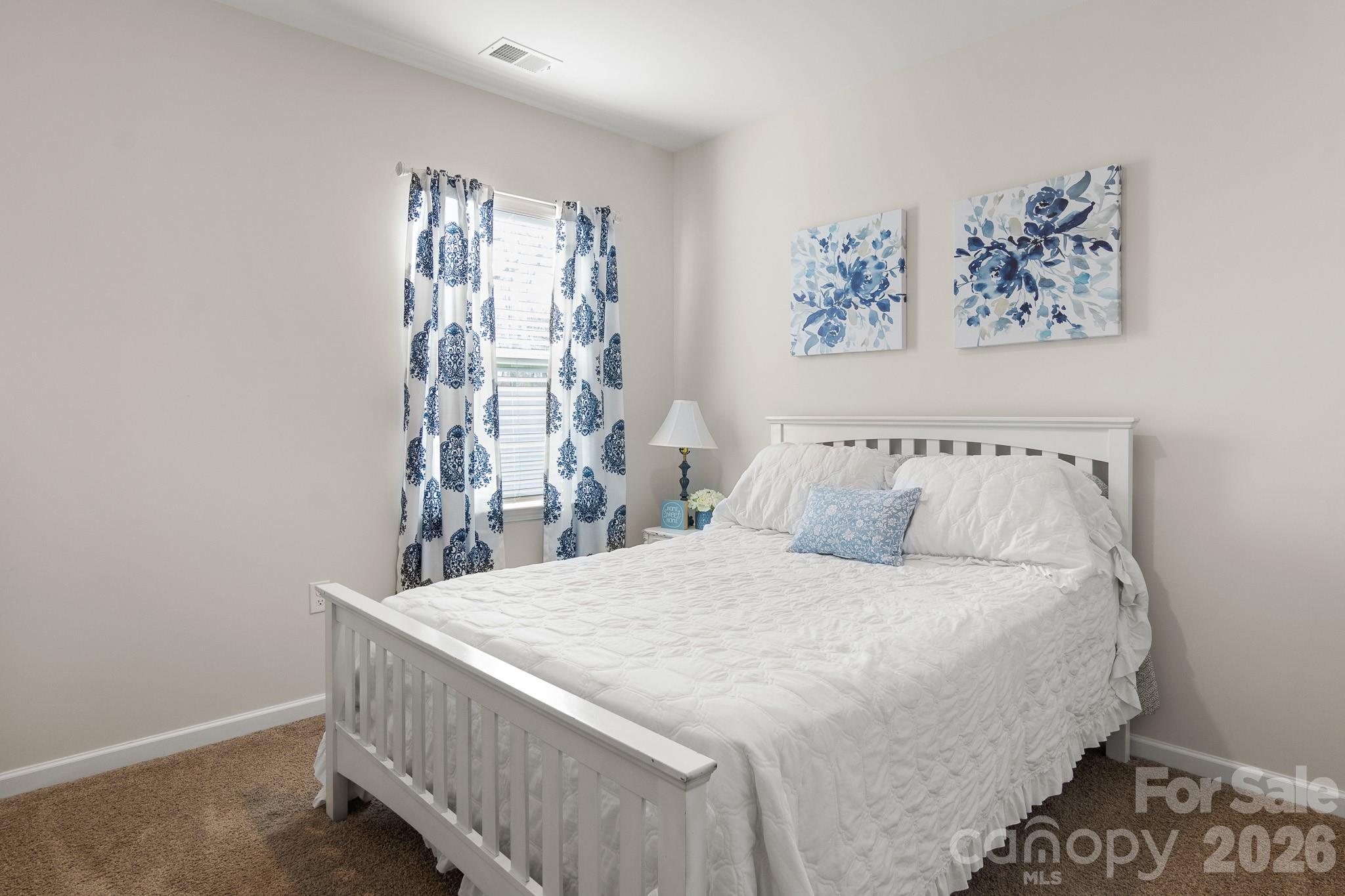 744 Saddlebred Lane Locust, NC 28097 - Photo 21 of 47 a bedroom with a bed and a window