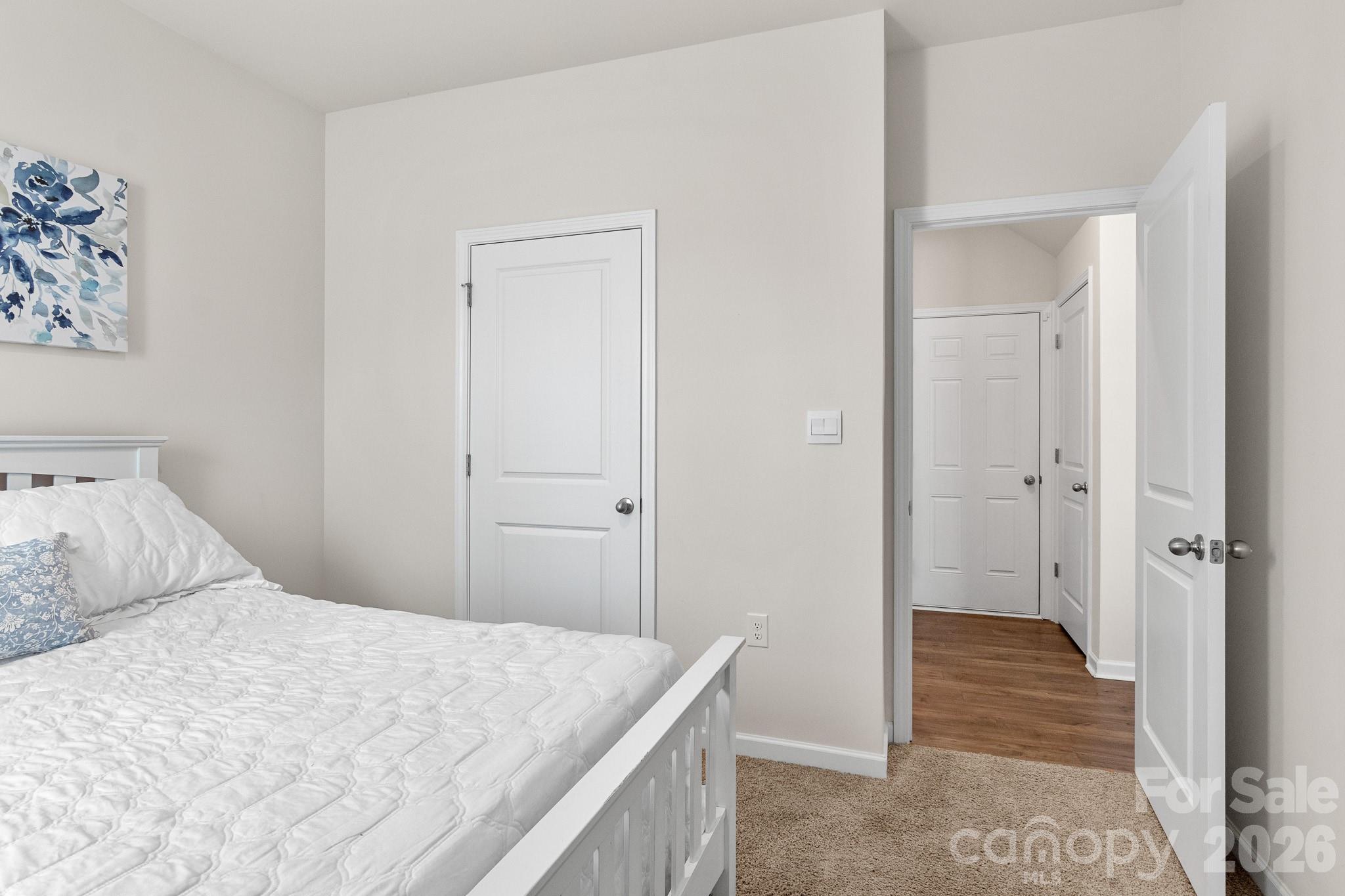 744 Saddlebred Lane Locust, NC 28097 - Photo 22 of 47 a bedroom with a bed and walk in closet
