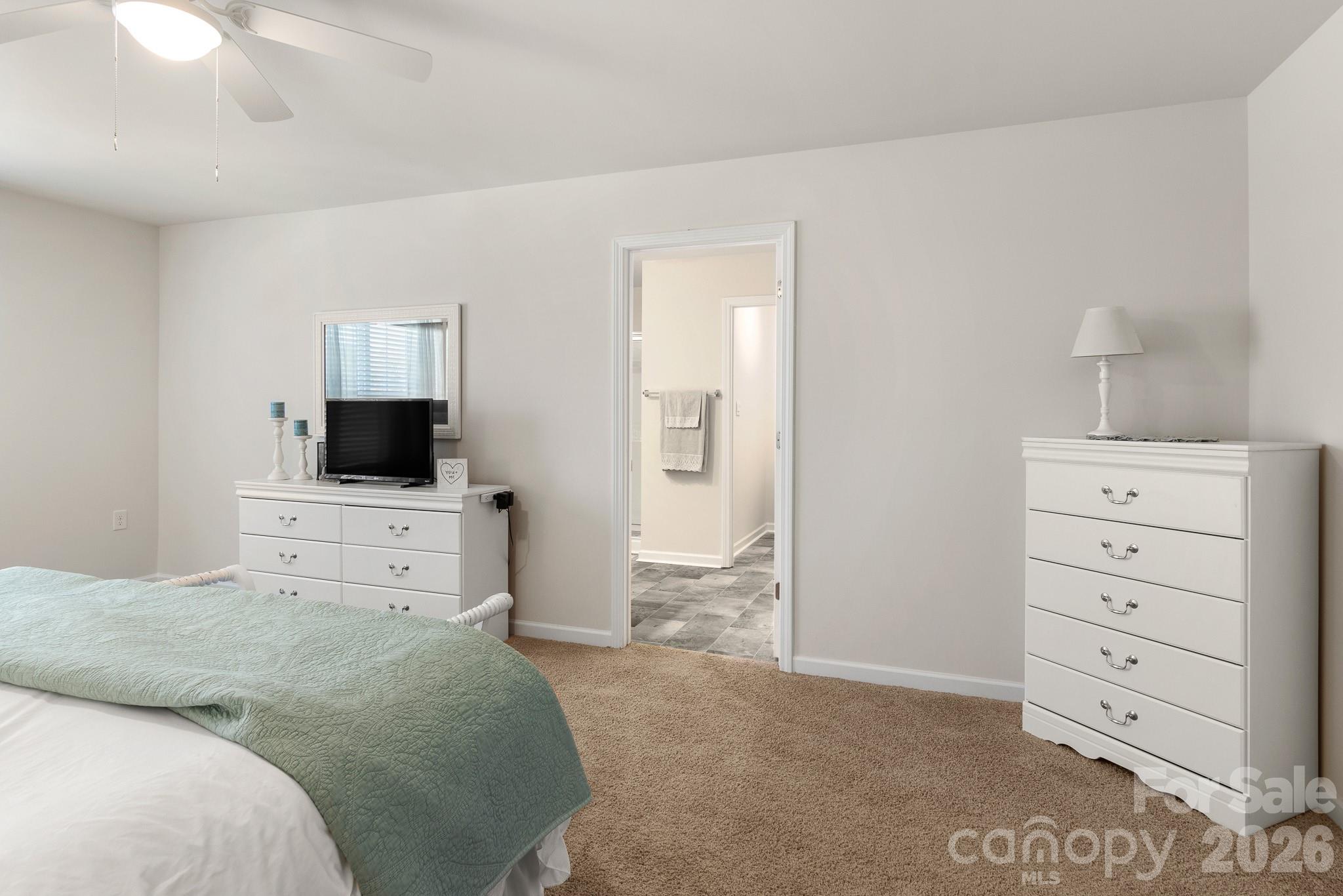 744 Saddlebred Lane Locust, NC 28097 - Photo 26 of 47 a bedroom with a bed and a television