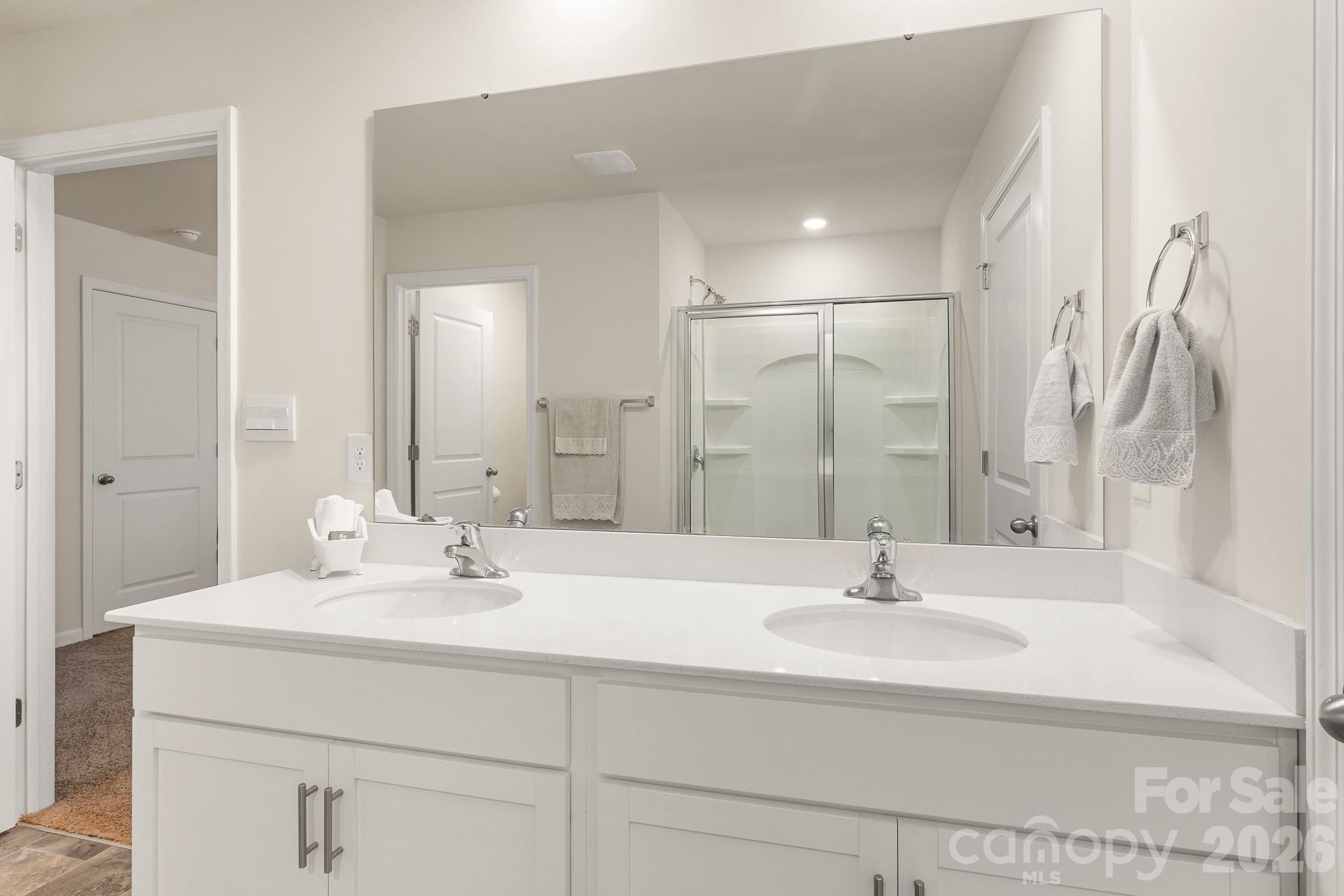 744 Saddlebred Lane Locust, NC 28097 - Photo 29 of 47 a bathroom with double vanity sink and a mirror