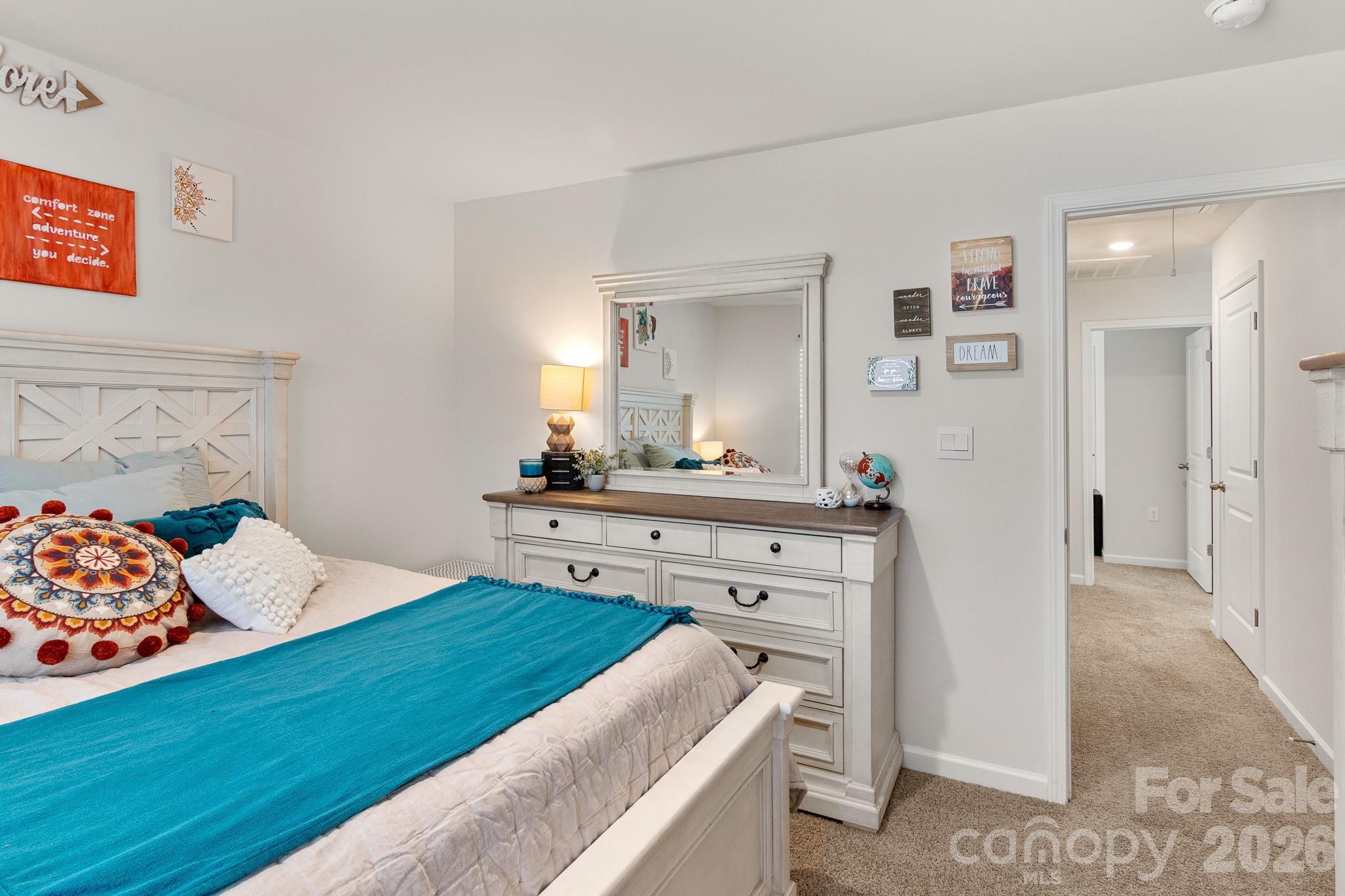 744 Saddlebred Lane Locust, NC 28097 - Photo 39 of 47 a bedroom with a bed and a dresser in it