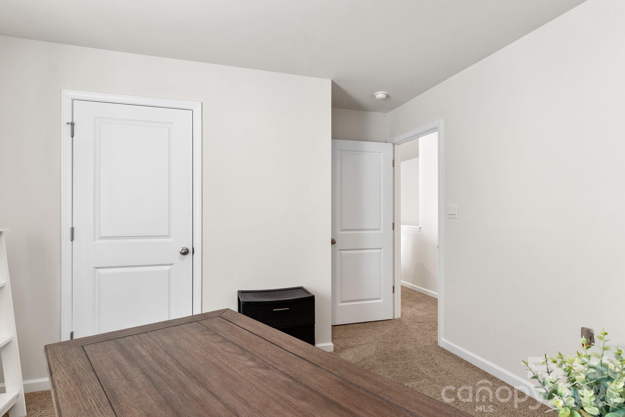 744 Saddlebred Lane Locust, NC 28097 - Photo 44 of 47 a view of empty room with wooden floor