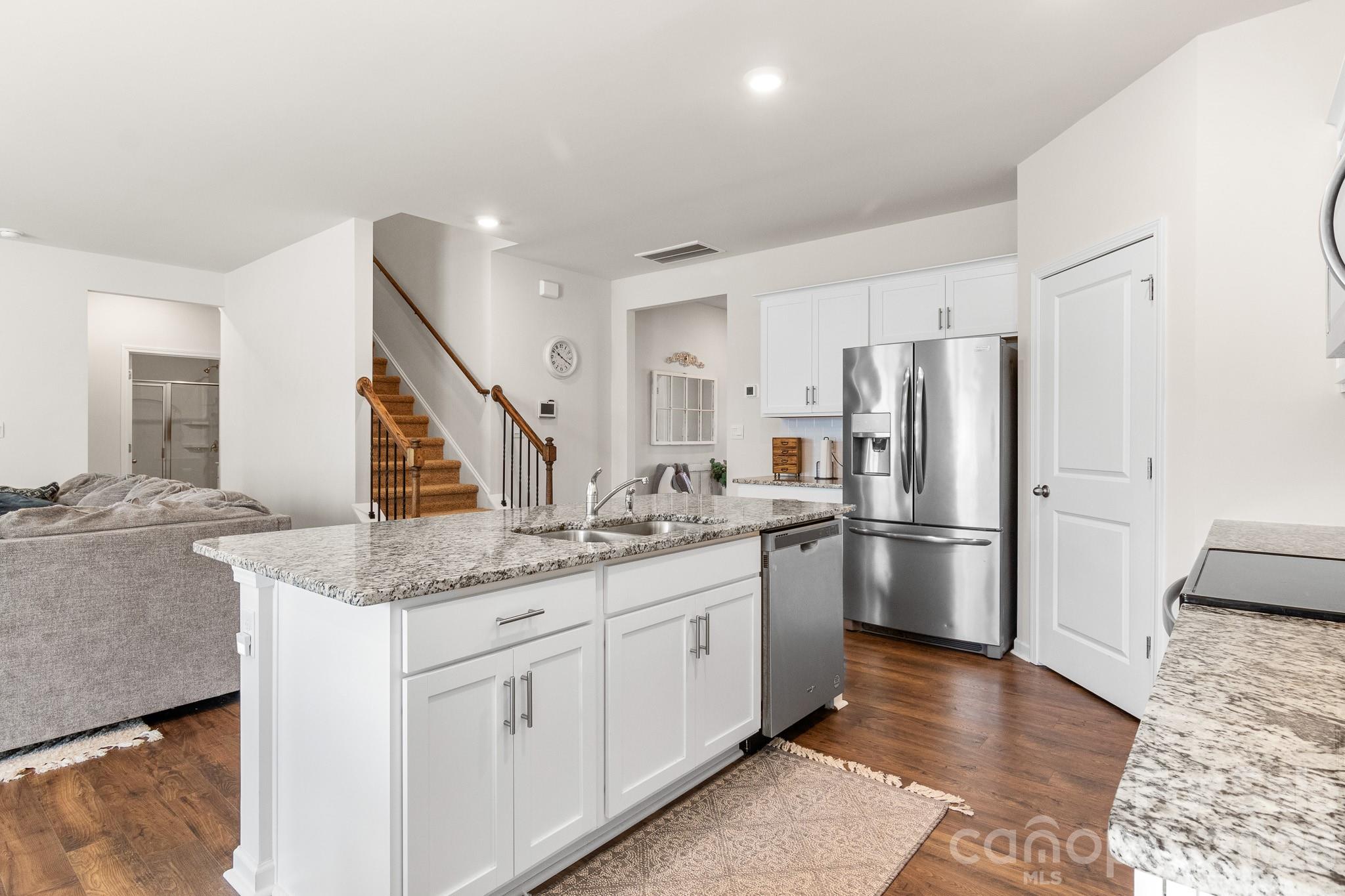 744 Saddlebred Lane Locust, NC 28097 - Photo 10 of 47 a kitchen with stainless steel appliances granite countertop a refrigerator and a sink