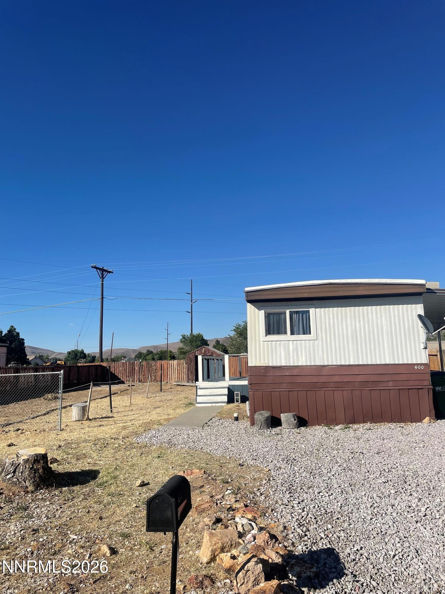 a front view of a house with parking space