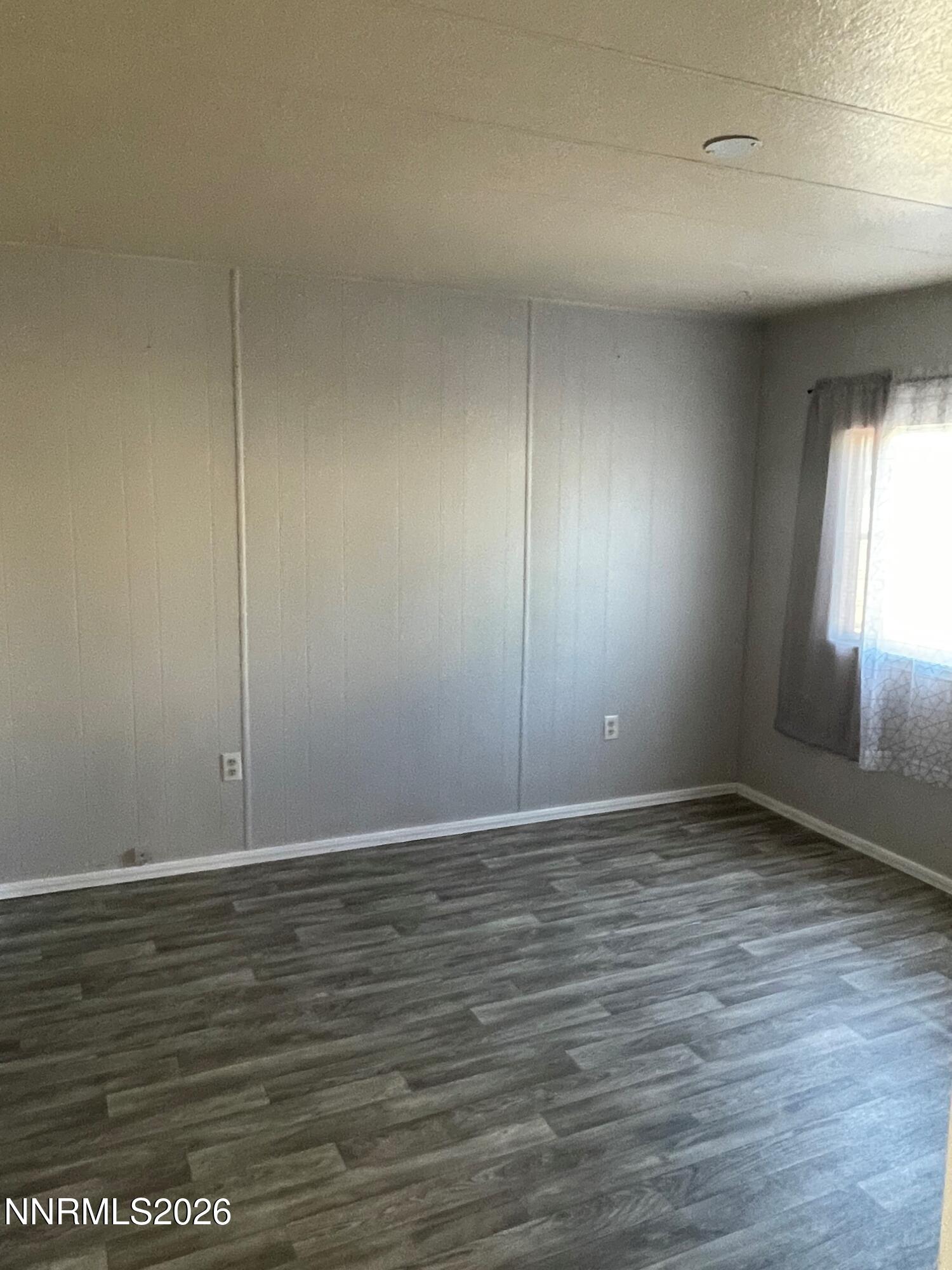 400 Mira Street Reno, NV 89521 - Photo 6 of 11 an empty room with wooden floor and windows