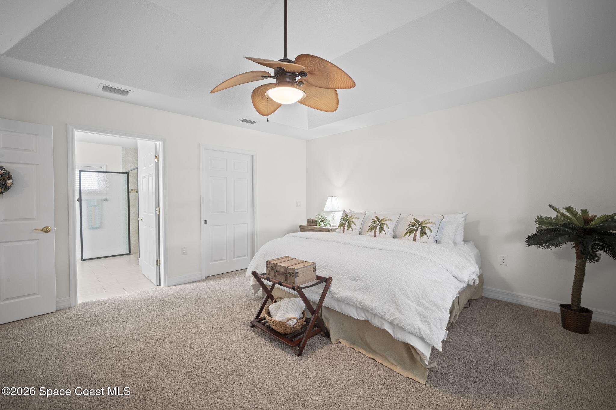 3125 Davis Road Mims, FL 32754 - Photo 34 of 47 a bedroom with a bed and a chandelier