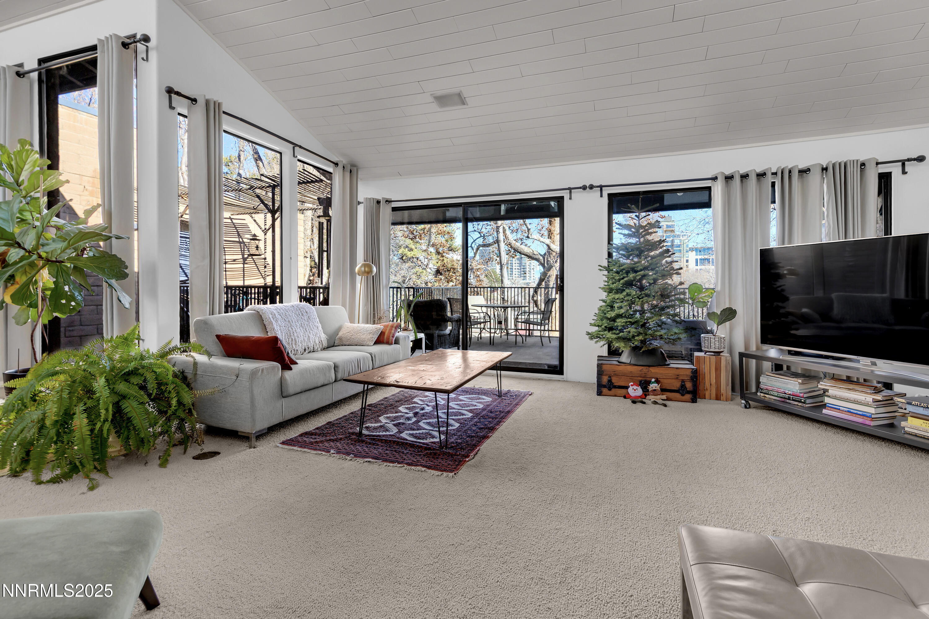 512 Island Avenue Reno, NV 89501 - Photo 12 of 30 a living room with furniture and a flat screen tv
