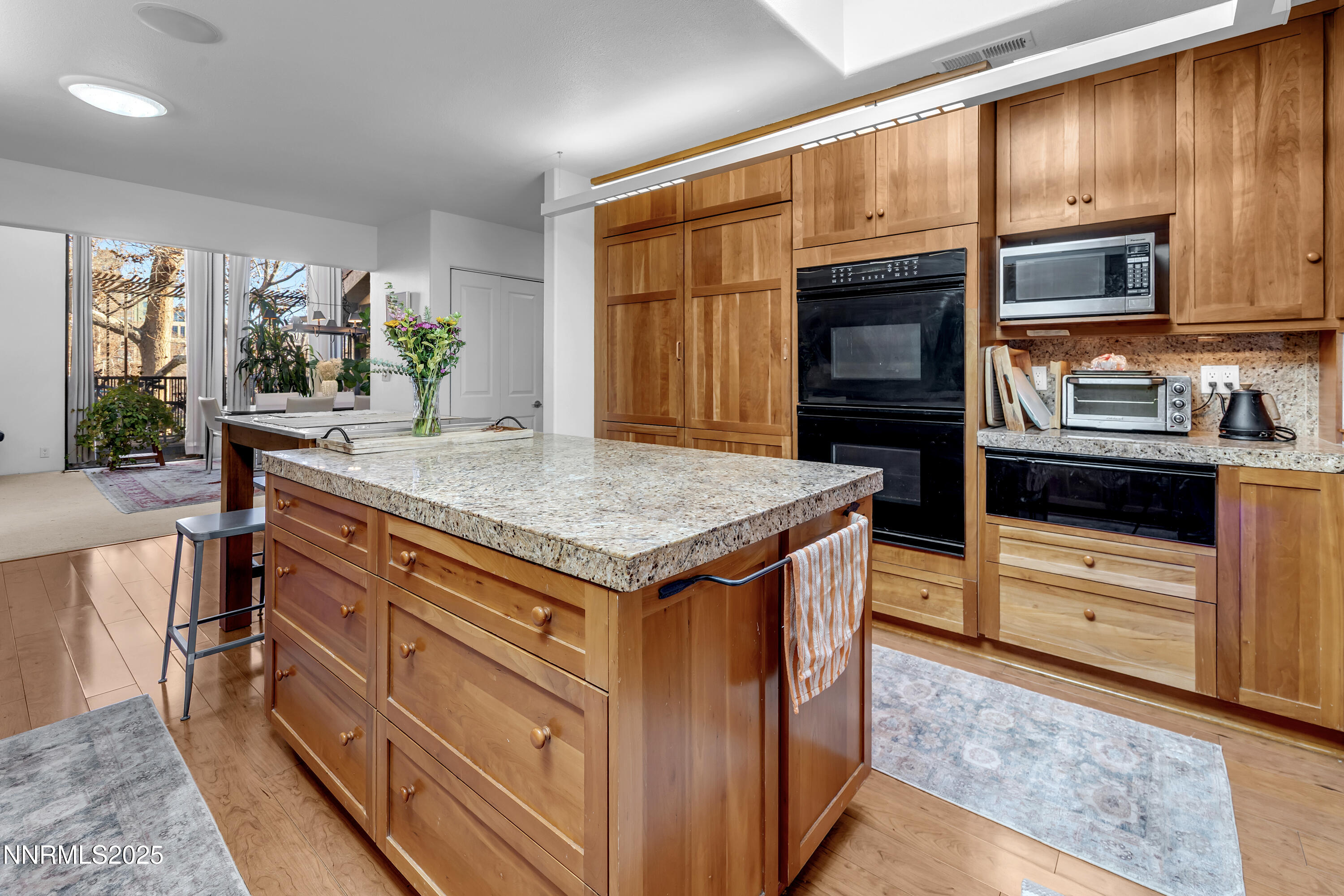 512 Island Avenue Reno, NV 89501 - Photo 16 of 30 a kitchen with granite countertop wooden cabinets and stainless steel appliances