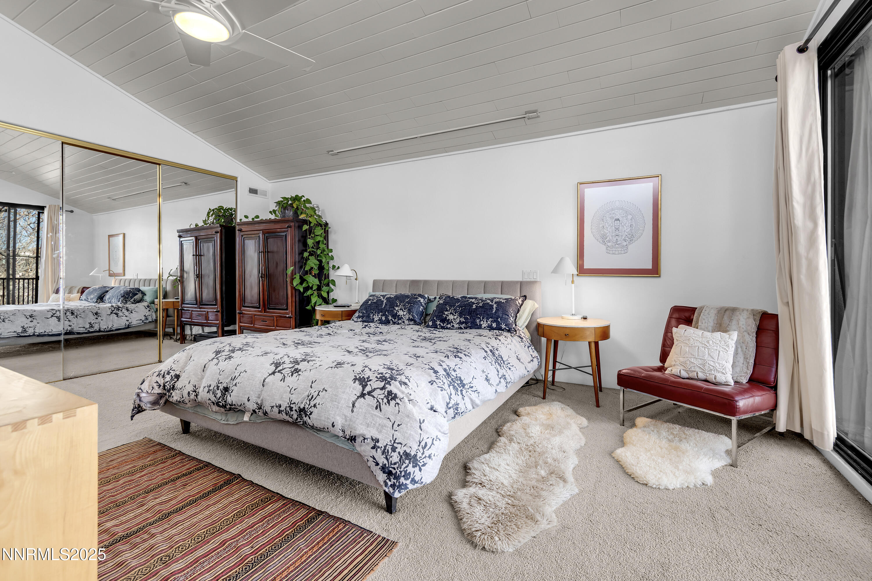 512 Island Avenue Reno, NV 89501 - Photo 21 of 30 a bedroom with bed and a chandelier