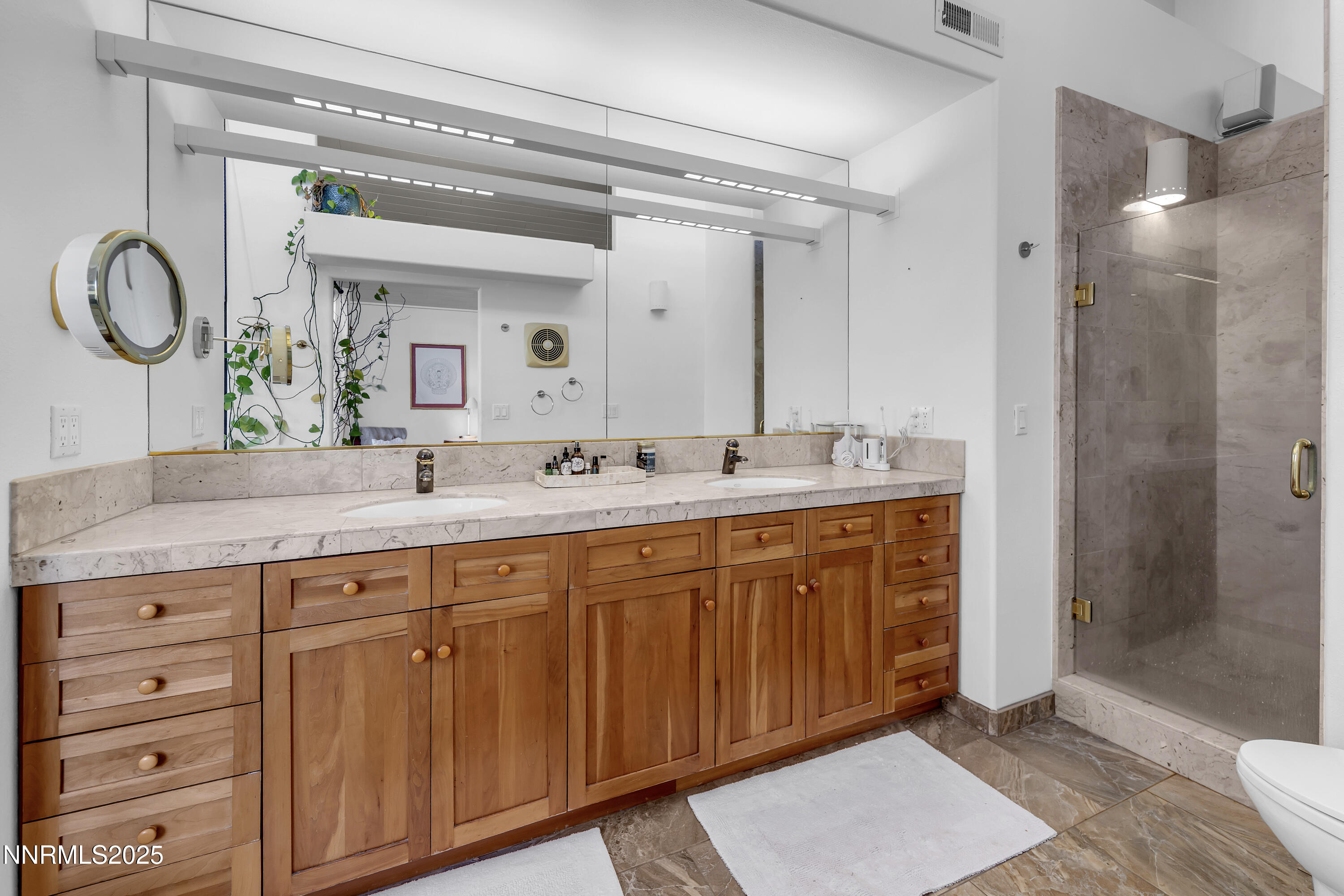 512 Island Avenue Reno, NV 89501 - Photo 22 of 30 a bathroom with a double vanity sink and a mirror