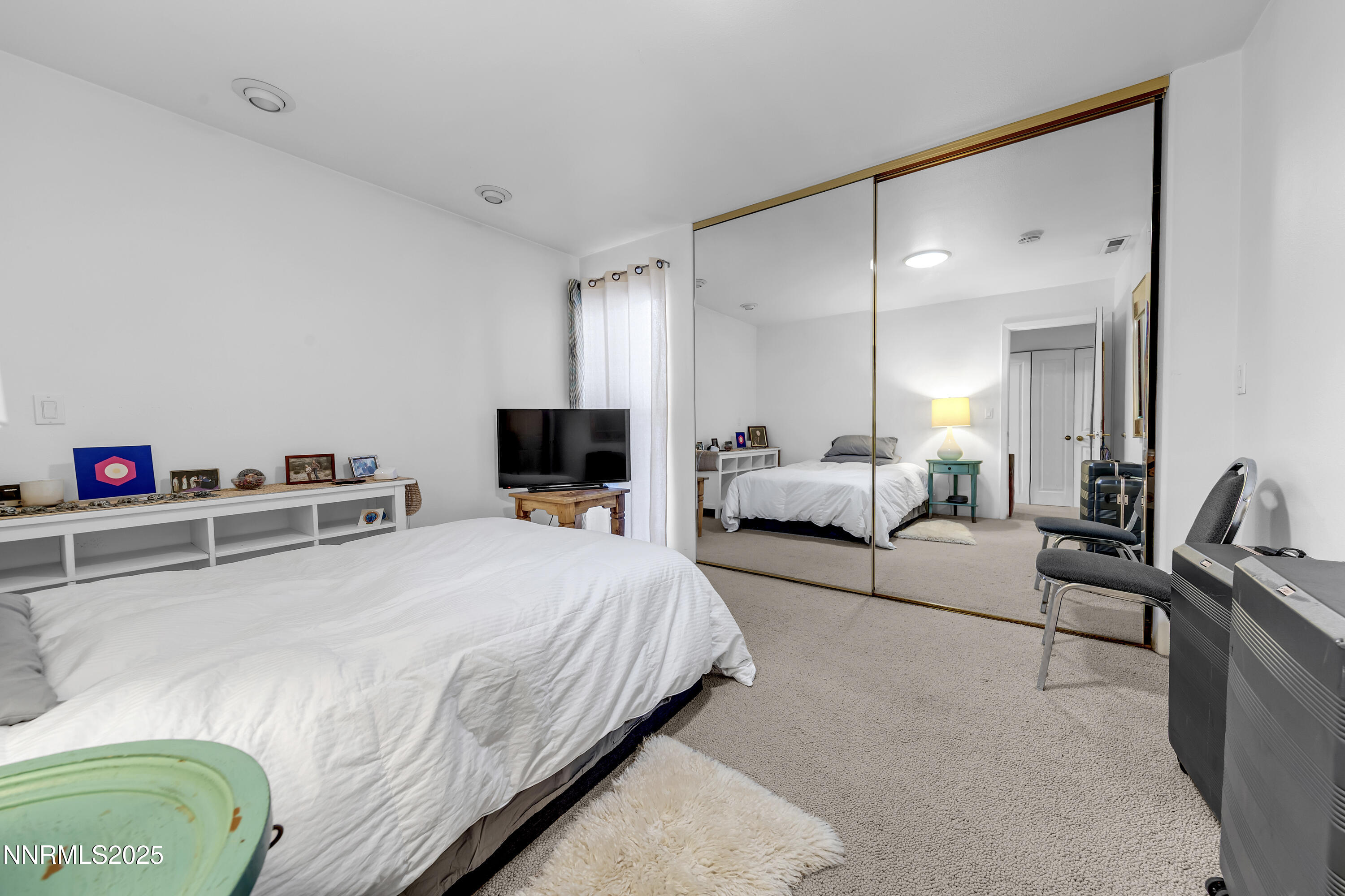 512 Island Avenue Reno, NV 89501 - Photo 26 of 30 a bedroom with a bed and a couch